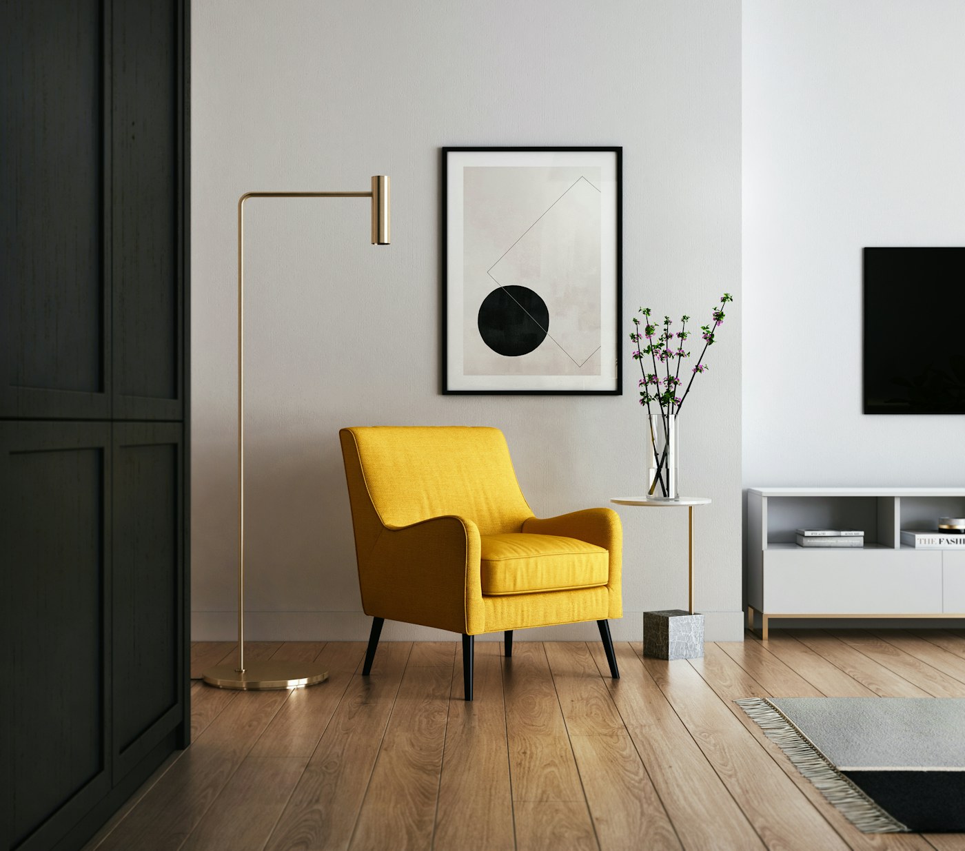 A person using a cordless vacuum in a compact bright living room