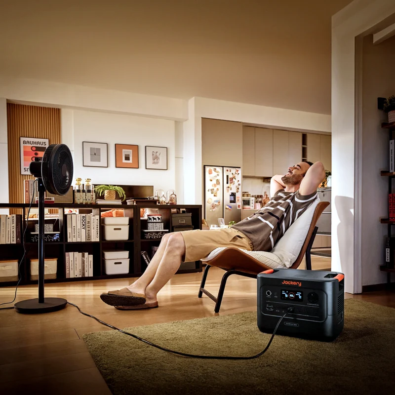 Official Jackery HomePower 3000 lifestyle image showing a portable station powering a fan indoors